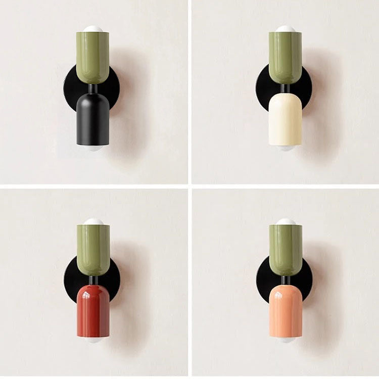 Four wall sconces with different colored shades on a white background
