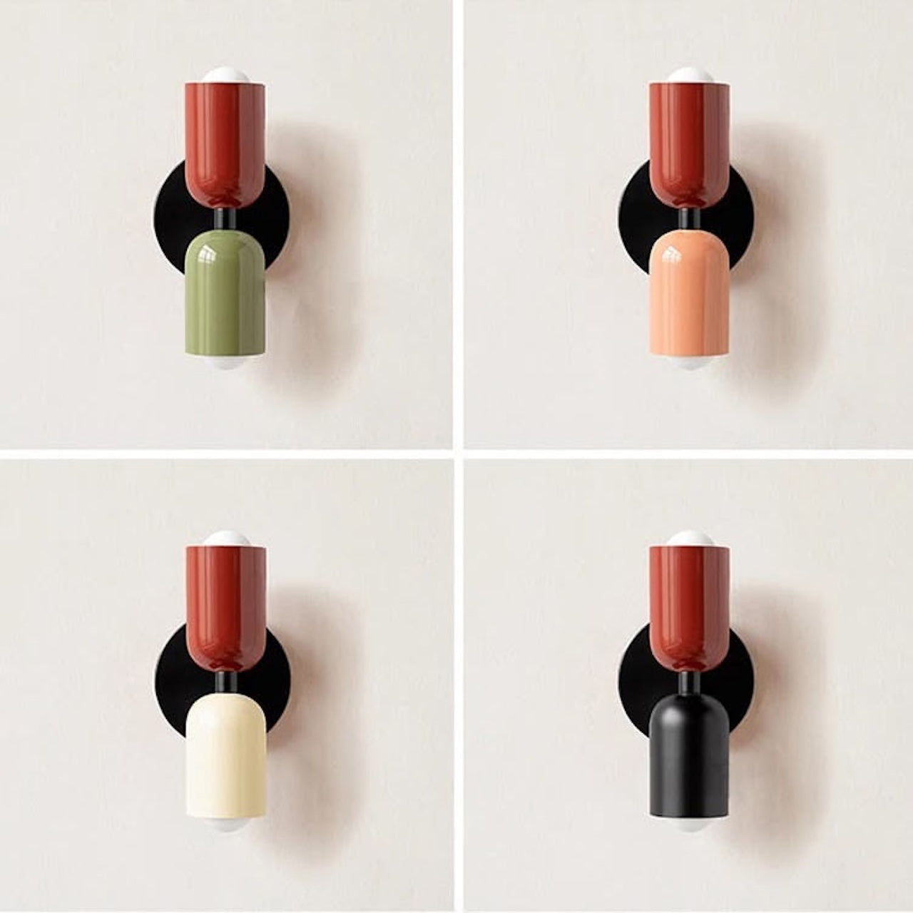 Four wall sconces with different colored cylindrical shades on a white background